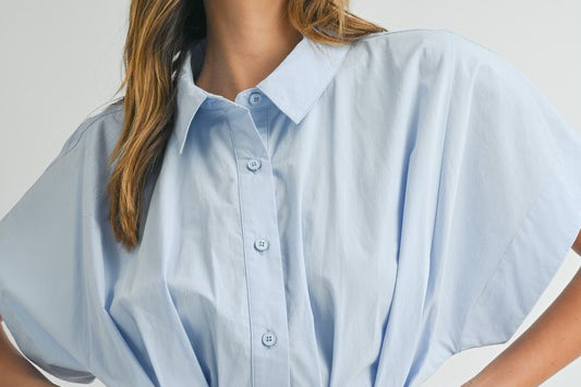 Discover versatile style with the Melissa Dress. This solid poplin mini dress features a front pleated button-down collared shirt design, complete with a self-tie waist detail that can be worn in the front or back. With a baby blue color, this dress is great for day or night.