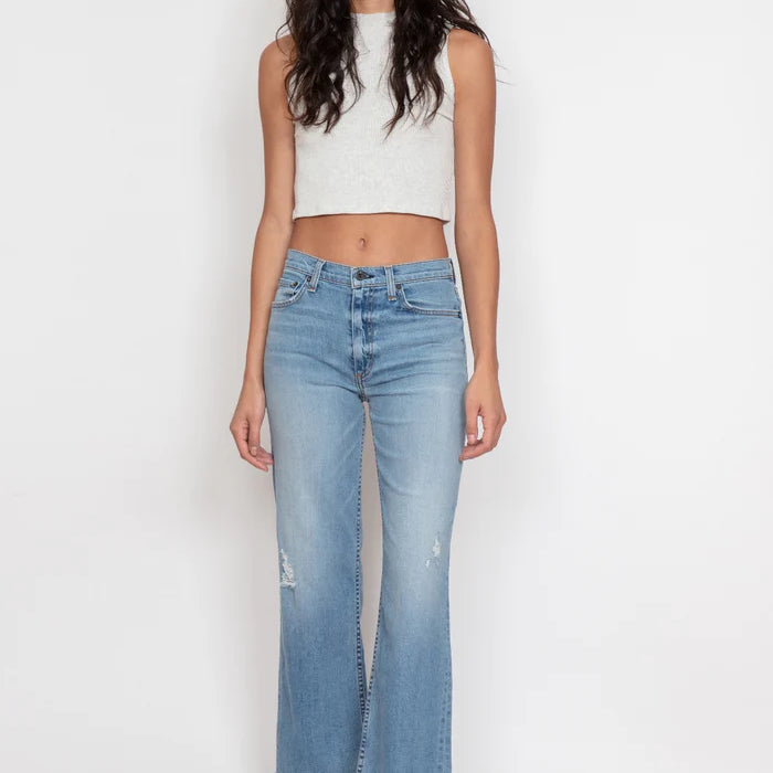 A high rise comfort stretch wide leg with cropped inseam and a fray hem
