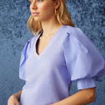 The Viva Popover is a feminine take on leisure wear, which combines soft French Terry with full cotton poplin sleeves, and a v-neckline. Pictured here in cool Peri purple, naturally faded and softened by an enzyme wash, Viva is easy to pair with a variety of bottoms - from denim to shorts or tucked into skirts.