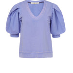 The Viva Popover is a feminine take on leisure wear, which combines soft French Terry with full cotton poplin sleeves, and a v-neckline. Pictured here in cool Peri purple, naturally faded and softened by an enzyme wash, Viva is easy to pair with a variety of bottoms - from denim to shorts or tucked into skirts.