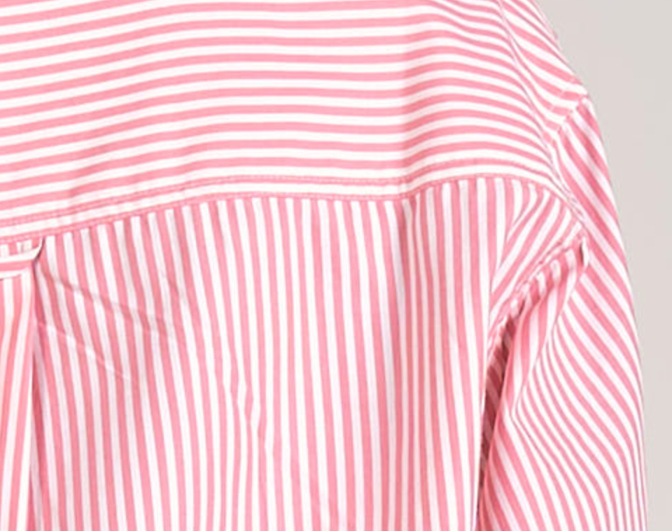 Introducing the Marissa Striped Oxford, the perfect blend of style and comfort. This pink and white stripe button down features a longer hem in the back for added coverage. 