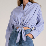 Get ready to turn heads in the Vizcaya Top! This playful button down top features a stylish blue and white stripe design, complete with a classic collar. With an elastic waist and cute tie detail, this top offers both comfort and style. 