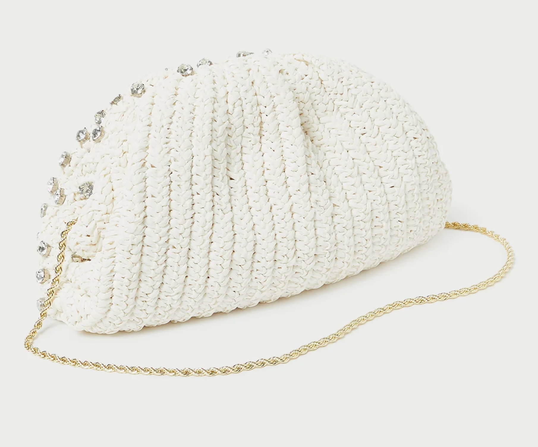 Dome-shaped frame pouch in natural crocheted raffia with rhinestone embellishment. Features a removable twisted gold metal shoulder strap, frame closure, full lining, and interior card slot