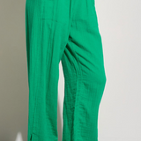 Upgrade your summer wardrobe with these bright green gauze pants. Designed with an elastic waist, these pants are both comfortable and stylish. Perfect for a day at the beach, boat, or poolside. Pair with a white tank and your favorite flip flops for the ultimate summer vibe.